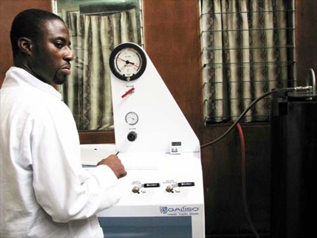 Jeffrey operates the Galiso Proof Pressure Tester, Accra, Ghana - Standards Board